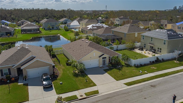 birds eye view of property with a water view