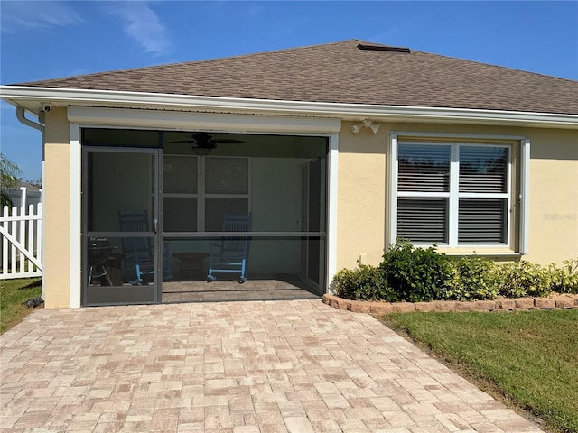 back of house with a sunroom, a patio area, and ceiling fan