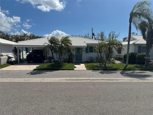 single story home featuring a carport