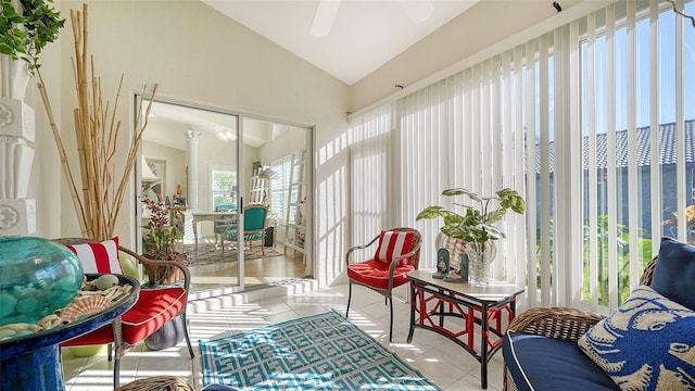 sunroom / solarium with ceiling fan and lofted ceiling