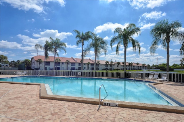 view of swimming pool with a patio