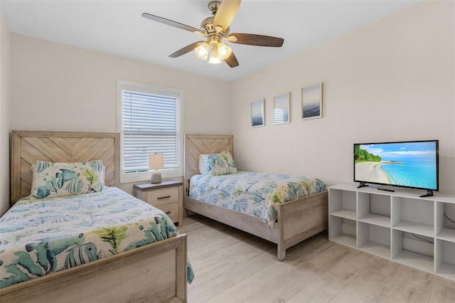 bedroom featuring ceiling fan and light wood-type flooring