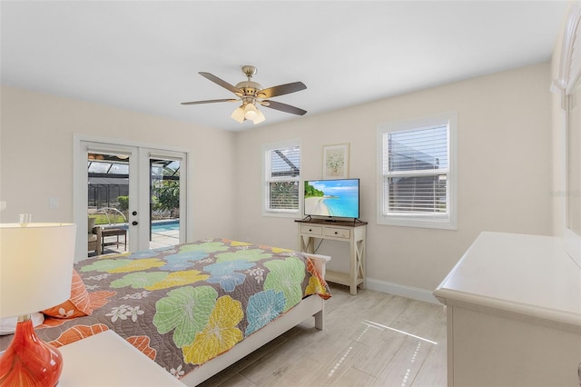 bedroom with access to outside, french doors, and ceiling fan