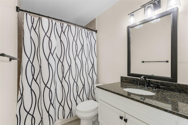 bathroom with vanity, toilet, and a shower with curtain