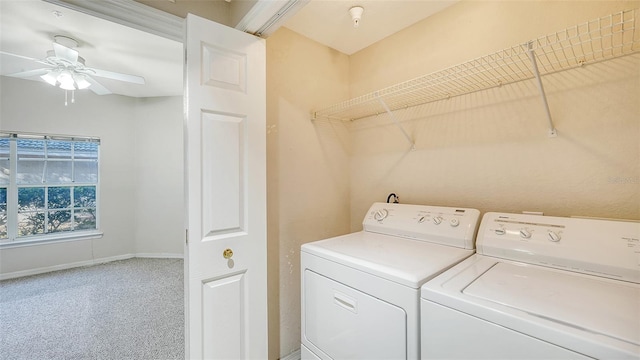 laundry area featuring washing machine and clothes dryer and ceiling fan