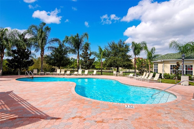 view of swimming pool featuring a patio