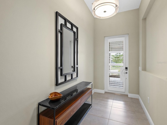 entryway featuring light tile patterned floors