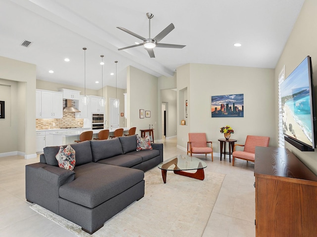 living room featuring ceiling fan, light tile patterned floors, and lofted ceiling with beams