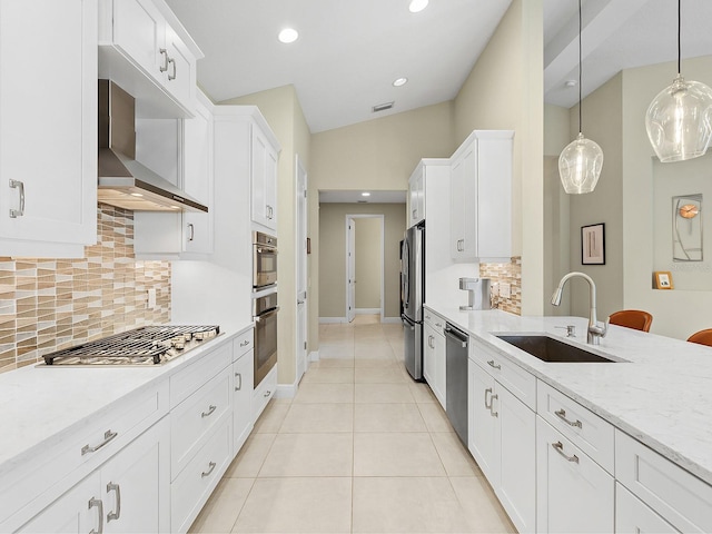 kitchen with light stone counters, stainless steel appliances, extractor fan, sink, and pendant lighting