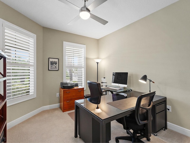 home office with light colored carpet and ceiling fan