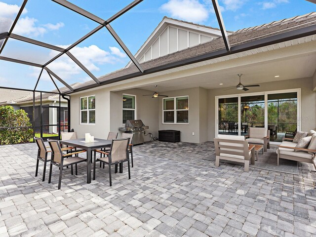 view of patio / terrace featuring ceiling fan, a grill, a lanai, and an outdoor hangout area