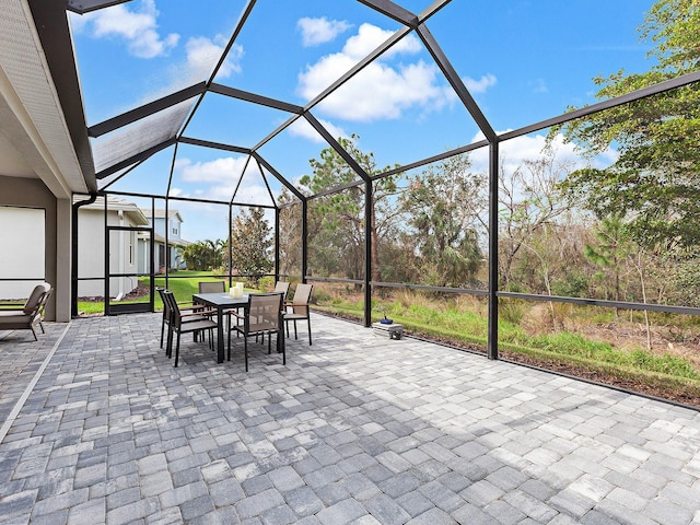 view of patio / terrace with a lanai