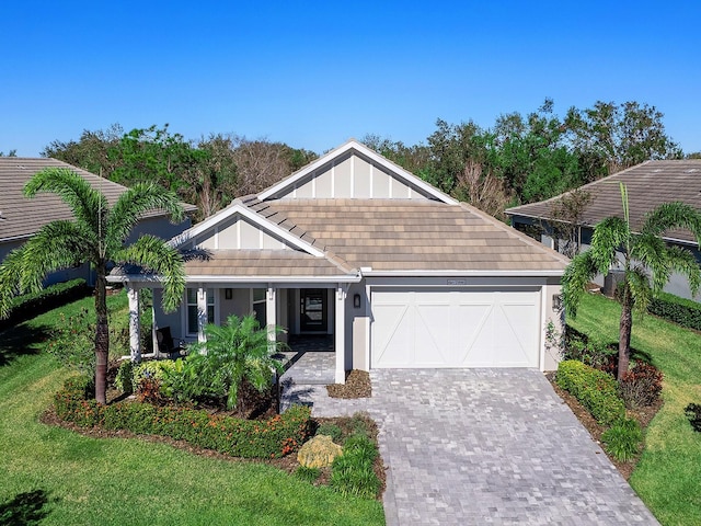 view of front of home featuring covered porch and a garage