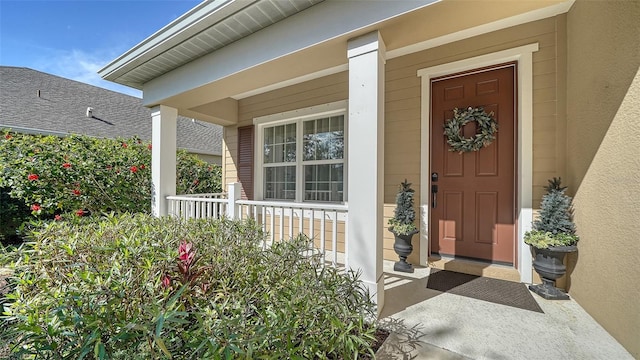 doorway to property with covered porch