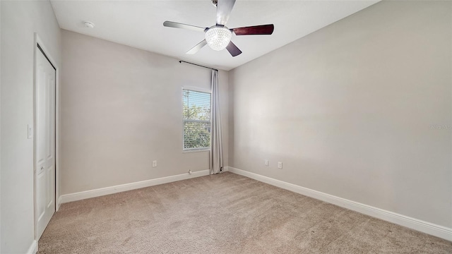 carpeted empty room with ceiling fan