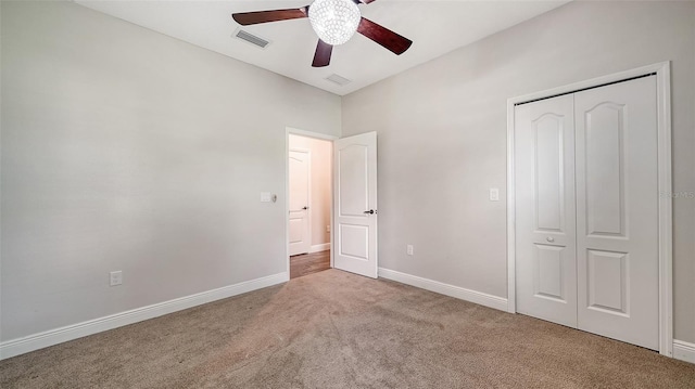 unfurnished bedroom featuring a closet, ceiling fan, and carpet flooring