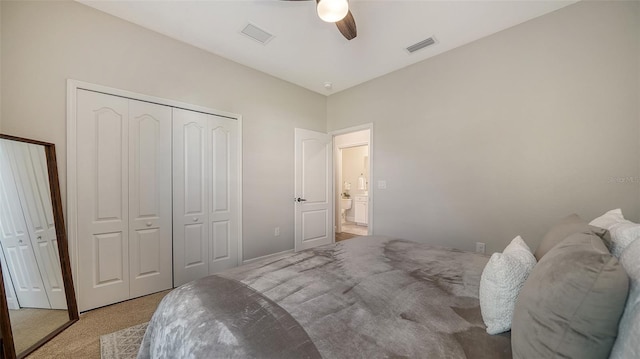 carpeted bedroom featuring a closet and ceiling fan