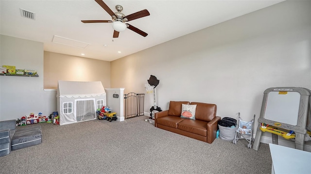 game room with ceiling fan and carpet