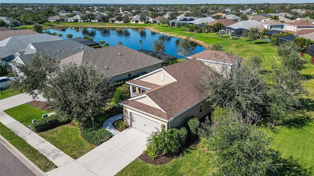 birds eye view of property with a water view