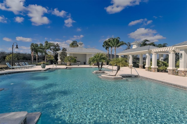 view of swimming pool featuring a patio area