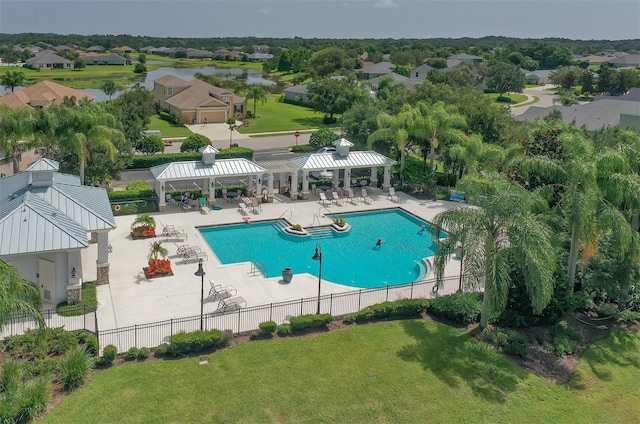 view of pool featuring a gazebo, a patio area, a water view, and a lawn