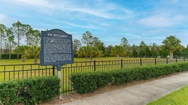 view of home's community featuring a lawn