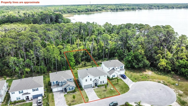 birds eye view of property with a water view