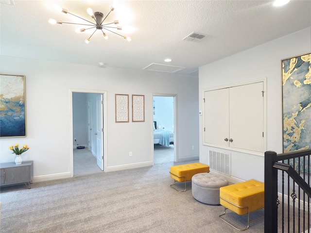 carpeted bedroom with a closet, a textured ceiling, and connected bathroom