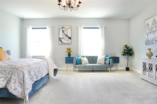 carpeted bedroom featuring multiple windows and an inviting chandelier