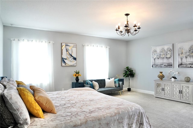 bedroom featuring light carpet and a notable chandelier