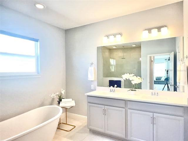 bathroom featuring vanity, independent shower and bath, tile patterned floors, and plenty of natural light