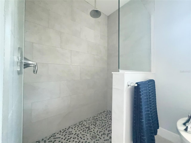 bathroom with tiled shower