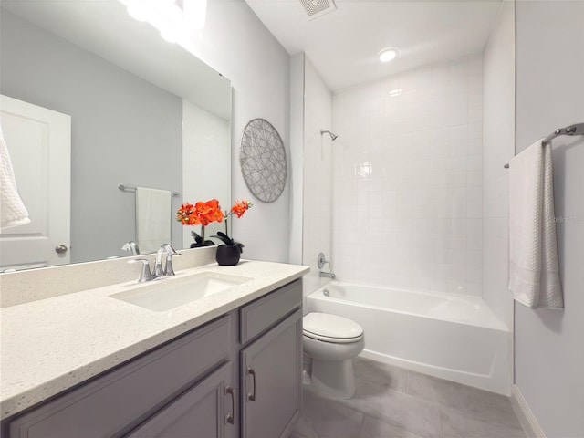 full bathroom with vanity, toilet, tiled shower / bath combo, and tile patterned flooring