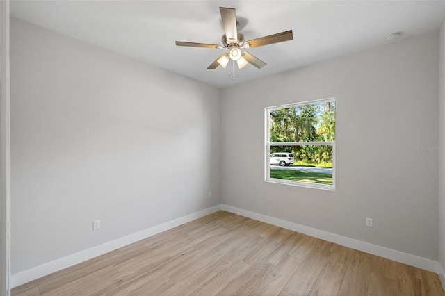 empty room featuring light hardwood / wood-style flooring and ceiling fan