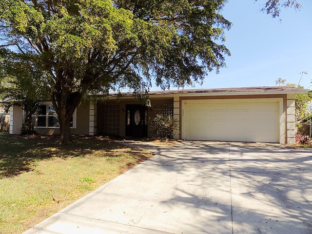 ranch-style home featuring a garage