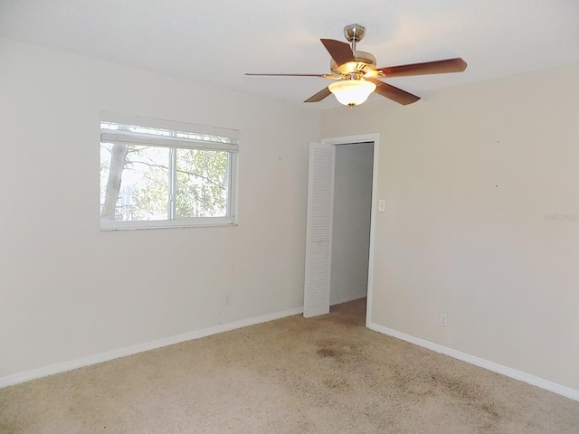 spare room with ceiling fan