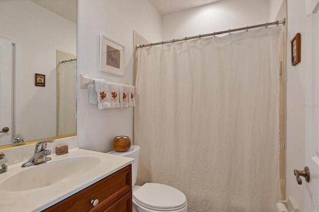 bathroom with toilet and vanity