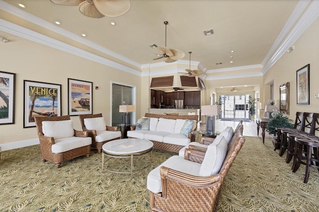 living room featuring a high ceiling and ornamental molding