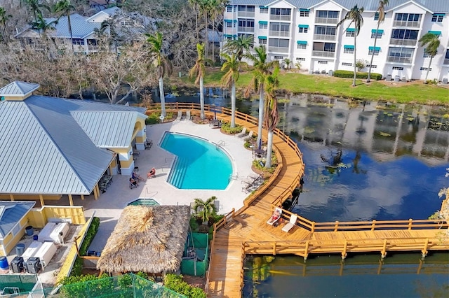 view of swimming pool featuring a water view