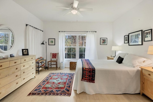 bedroom featuring ceiling fan and light wood-type flooring