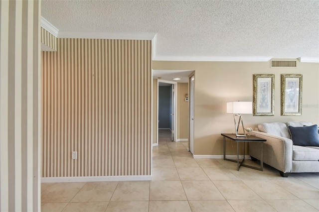 tiled living room featuring a textured ceiling and crown molding