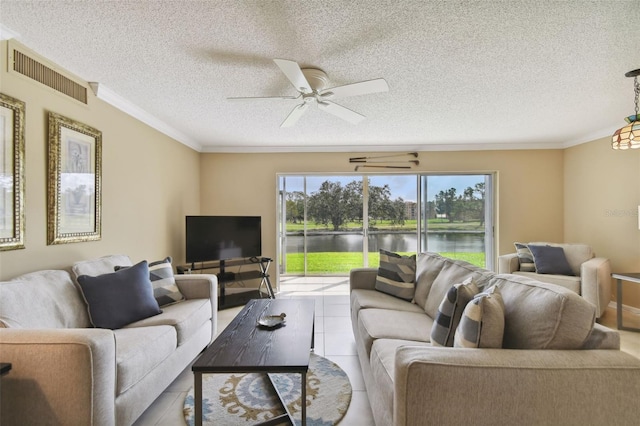 living room with ornamental molding, a textured ceiling, ceiling fan, and light tile patterned floors