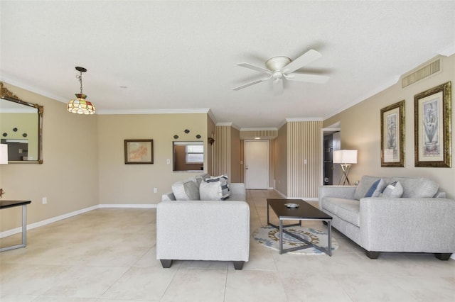 living room featuring ceiling fan, a textured ceiling, light tile patterned floors, and ornamental molding