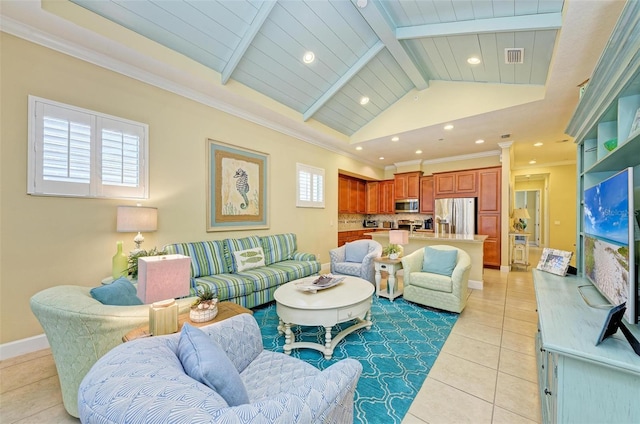 living room featuring ornamental molding, light tile patterned flooring, vaulted ceiling with beams, and plenty of natural light