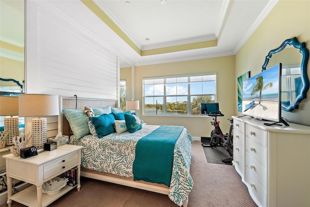 bedroom featuring ornamental molding, a tray ceiling, and light colored carpet