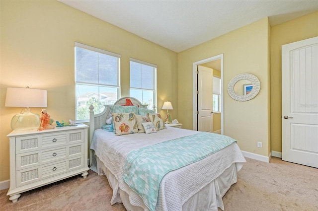 bedroom with light carpet