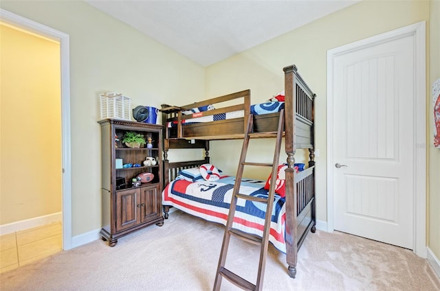 bedroom featuring light colored carpet