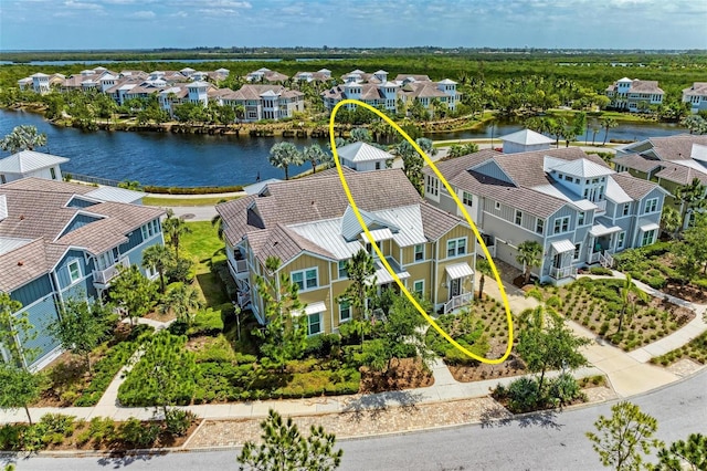 birds eye view of property with a water view