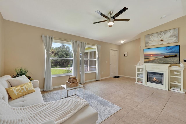 tiled living room featuring lofted ceiling and ceiling fan