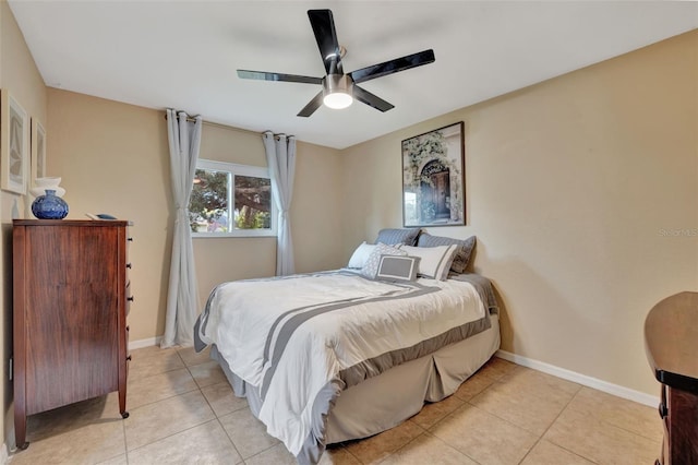 tiled bedroom with ceiling fan